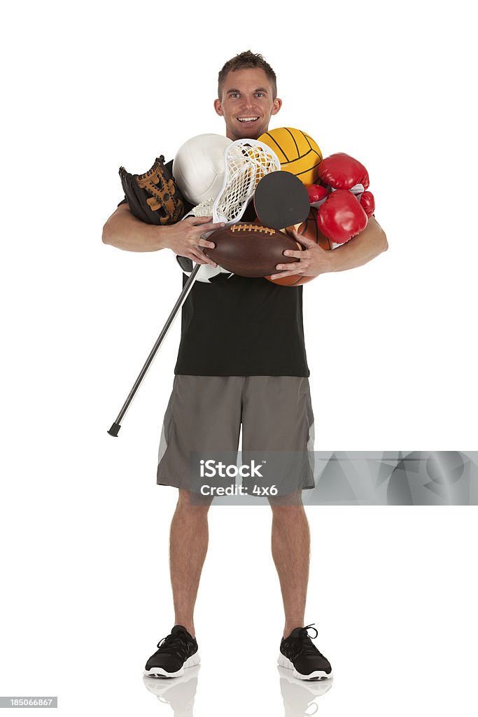 Portrait of a man holding sports equipments Basketball Player Stock Photo