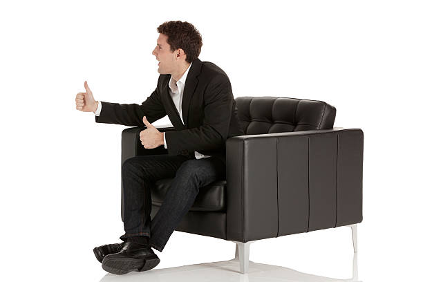 empresário sentado na cadeira de braços - thumbs up business people isolated imagens e fotografias de stock