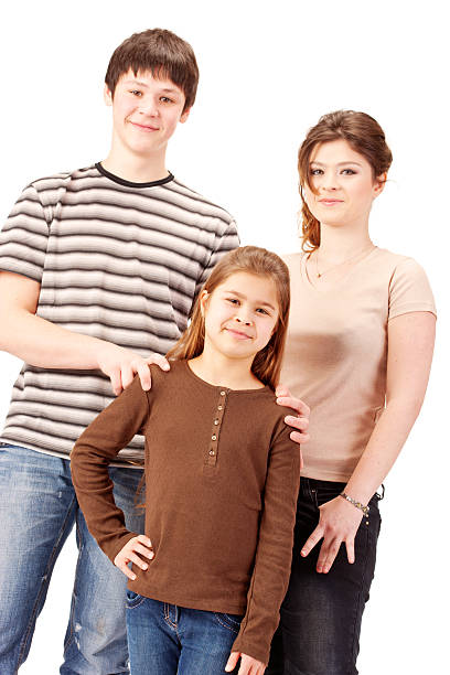 Brother and Sister posing on white background