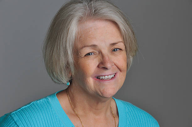 istock Mature woman in her 60's smiling 185067136