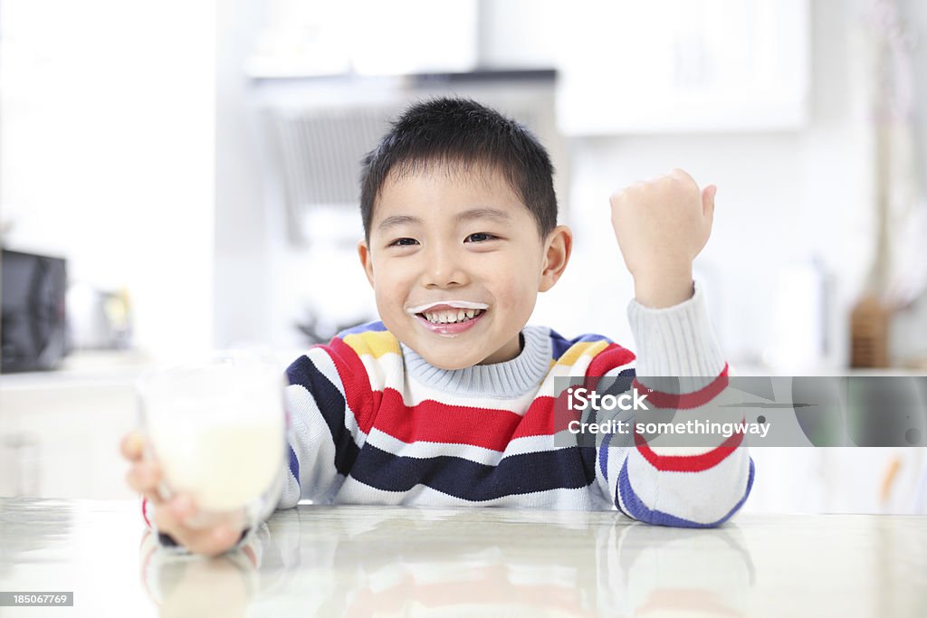 Asian boy drinking milk Asian and Indian Ethnicities Stock Photo