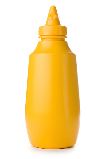 Plastic squeezey yellow mustard bottle isolated on a white background