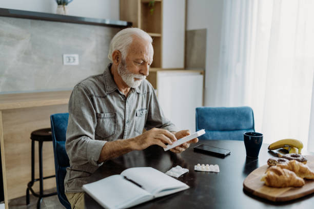 istock Senior man taking his medicine 1850679816