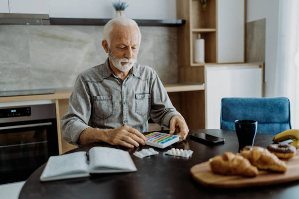 istock Senior man taking his medicine 1850679818