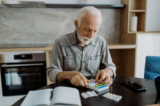 istock Senior man taking his medicine 1850680348