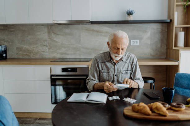 istock Senior man taking his medicine 1850680350