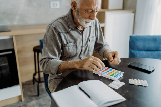 istock Senior man taking his medicine 1850680352