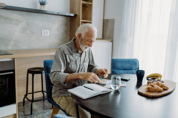 istock Senior man taking his medicine 1850680936