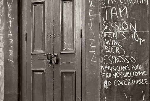 Entrance door of a run down jazz bar. England, 2011