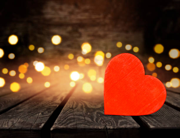 istock Red heart on wooden table 1850685640