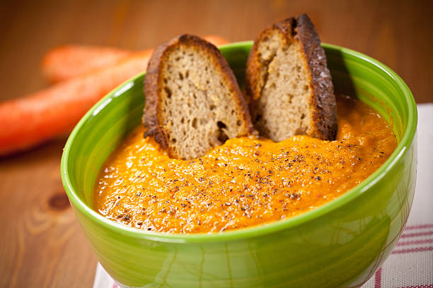 Carrot soup with croutons stock photo