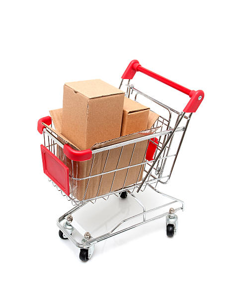 istock Shopping cart full of boxes isolated on white background 185069078