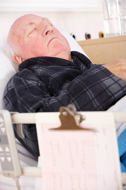 istock Senior man in hospital bed 185069082