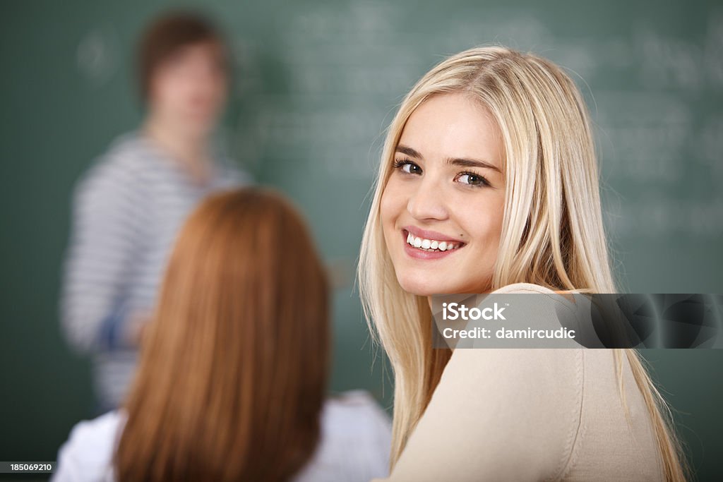 Beautiful happy female student in classroom 20-29 Years Stock Photo