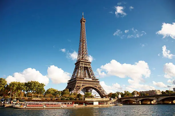 Photo of Eiffel Tower on the bank of river seine