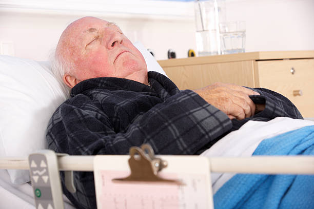 istock Senior man in hospital bed 185069602