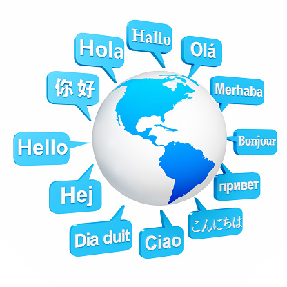 Several important languages on paper with world map background. Depth of field image. Translate and languages education concept.