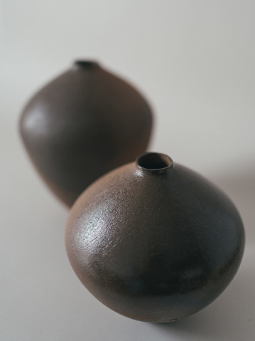 Studio shot of the ceramic flower vase, earthy tones