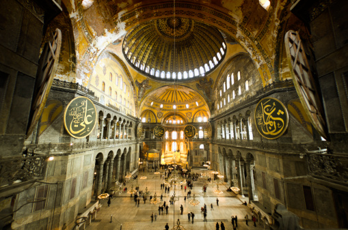 Hagia Sophia (Aya Sofya) indoors captured with fish-eye lens. Warm tone given. Unrecognizable people visible.See more Istanbul