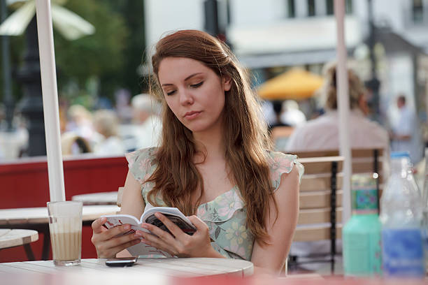 istock Tourist Looking at Berlin City Guide Book 185070573