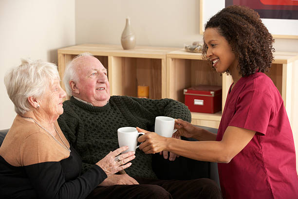 istock Nurse visiting senior couple at home 185071018