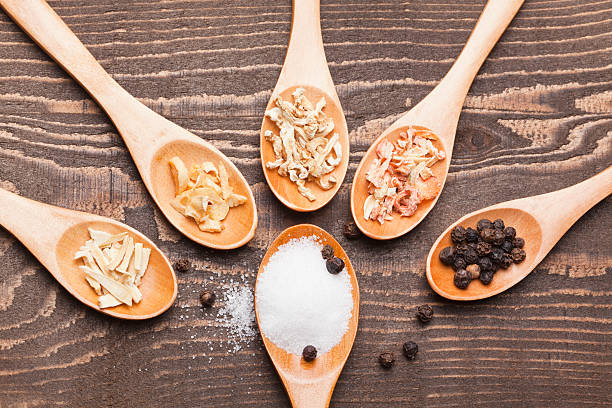 istock Spices and herbs in wooden spoons 185071125