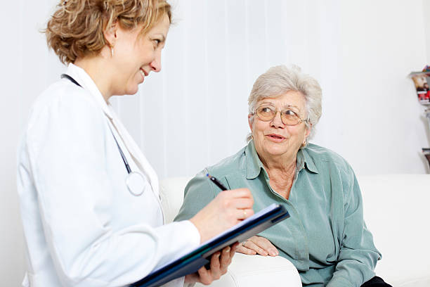 istock Senior Woman at doctors office 185071292