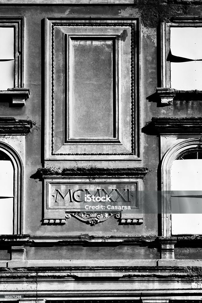 Old building facade Ornamental fake window on building exterior with roman numerals equvalent to the date 1921. 1921 Stock Photo