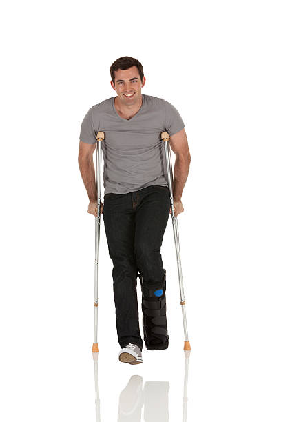istock Injured man walkiing with the help of crutches 185071726