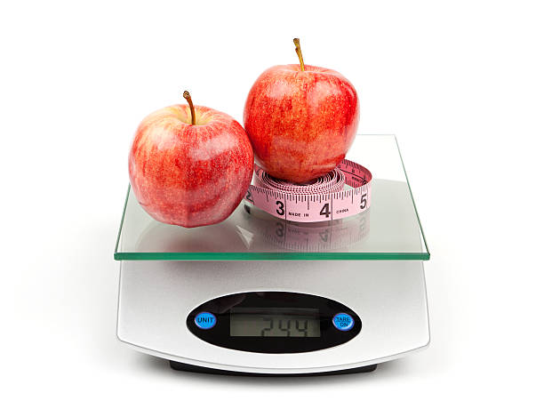 istock Apples and Tape Measure on Diet Scale 185071772