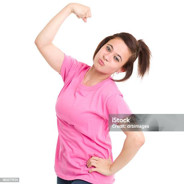 Teenage Girl Flexing Arm Stock Photo - Download Image Now - Pink Color, T-Shirt, 14-15 Years