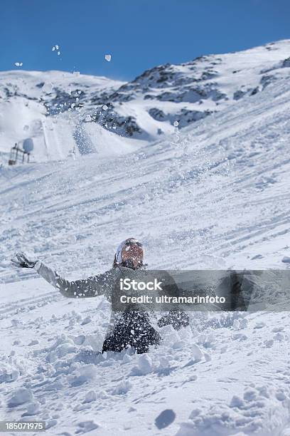 Female Skier Playing With Snow Outdoor Stock Photo - Download Image Now - Adult, Adults Only, Candid