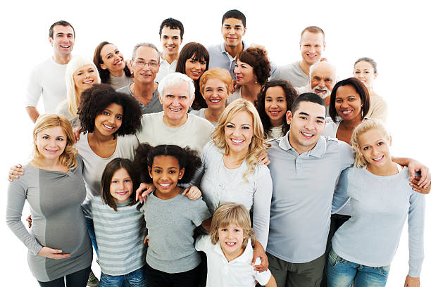 Large Group of Happy People smiling and embracing. Portrait of a diversity Mixed Age and Multi-generation Family embracing and standing together. Isolated on white background.    large group of people facing camera stock pictures, royalty-free photos & images