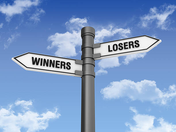 istock Directional Sign with WINNERS LOSERS Words and Sky 185072318