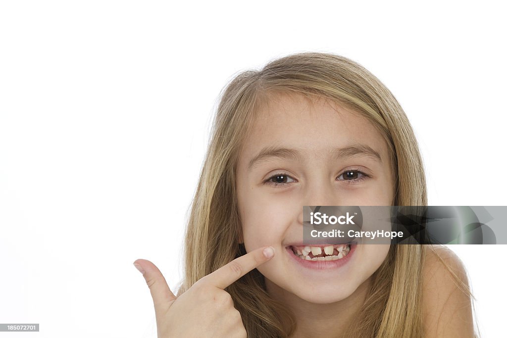 Menina apontando no seu sorriso - Foto de stock de Enviesado royalty-free