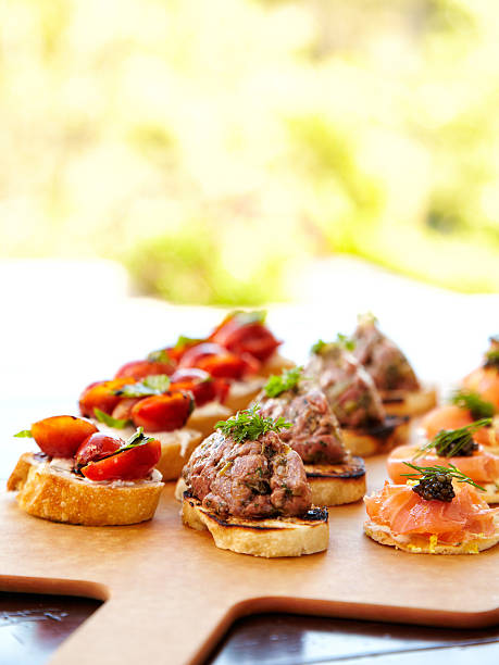 Bruschetta with cheese, tomatoes, foie gras, and wild salmon