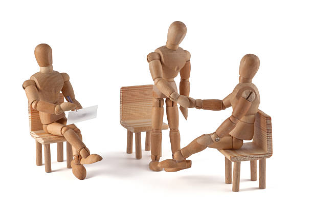 istock wooden mannequin talking - hand shaking 185072803