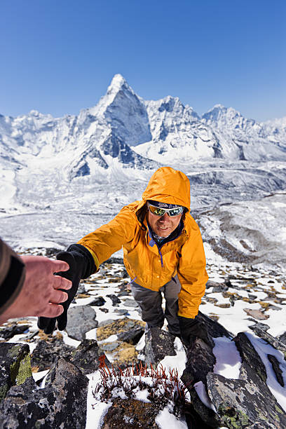 istock Nepali sherpa climbing in Himalayas 185073680