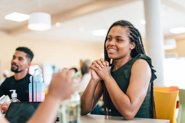 istock College friends talking in the cafeteria 1850737601