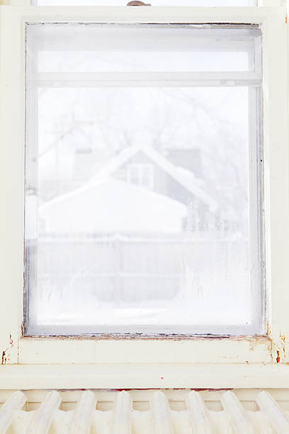 istock Color Image of Damaged, Rotting Window Inside Older Home 185074271