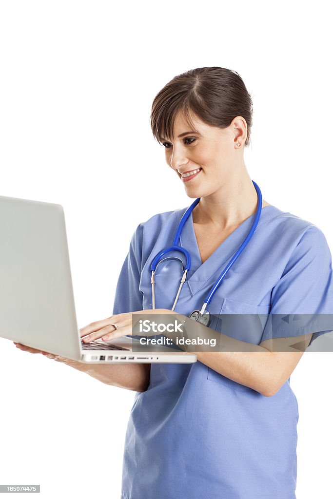 Female Nurse/Doctor Working on Laptop, With White Background "Color image of a female nurse/doctor looking at laptop computer, isolated on white background." 20-29 Years Stock Photo