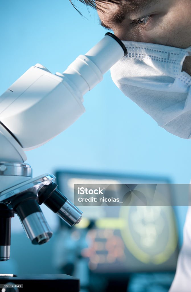 Scientific research A scientist using a microscope 30-39 Years Stock Photo