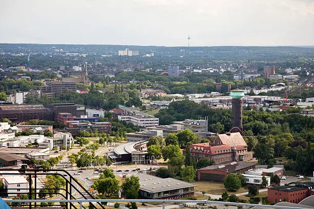 view over Oberhausen,  seen from the roof of the Gasometer, building in the forground is the former Werksgasthaus,which was formerly used to store gas, and is today a place where exhibitions take place and to allow visitor a view over the Ruhr area