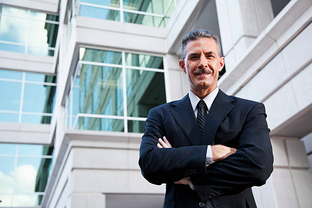 istock Businessman standing outside office building 185075385