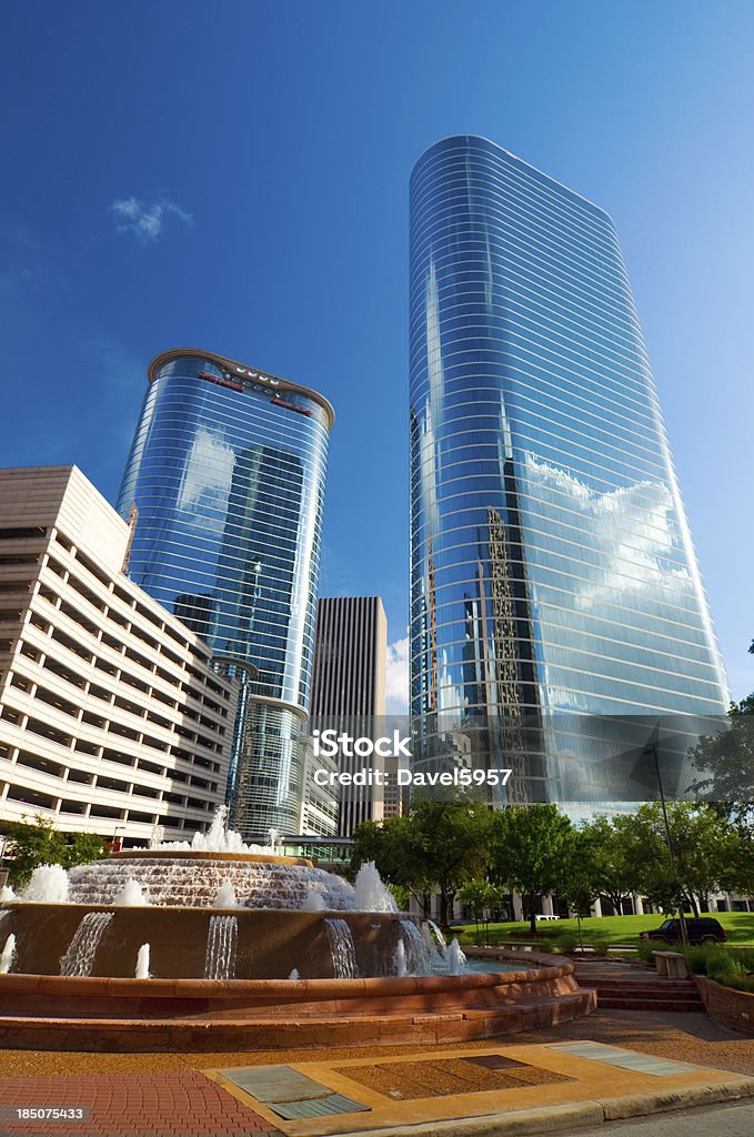 Houston glass skyscrapers Houston Glass Skyscrapers / office buildings (1400 Smith Street and 1500 Louisiana Street) and a fountain and trees in the foreground. Houston - Texas Stock Photo