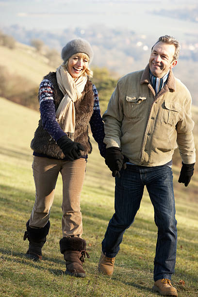 istock Mature couple on country walk in winter 185075455