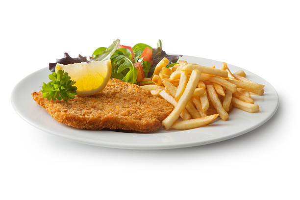 Meat: Schnitzel, French Fries and Salad More Photos like this here... schnitzel stock pictures, royalty-free photos & images