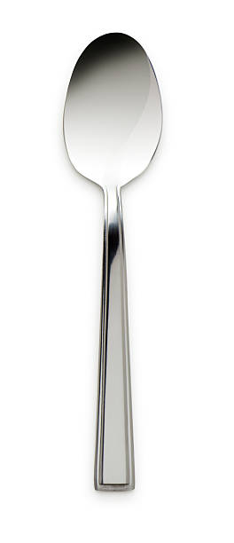 Silver Spoon on White This is a photo of a silver spoon isolated on a white background. There is a clipping path included with this file.Click on the links below to view lightboxes. baby spoon stock pictures, royalty-free photos & images
