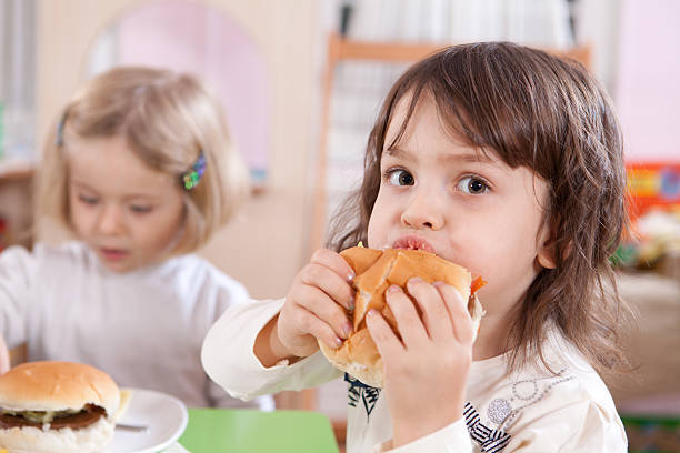 istock Little Girl and Hamburger 185076238