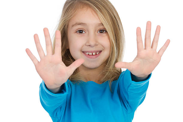 istock little girl showing her clean hands 185076666